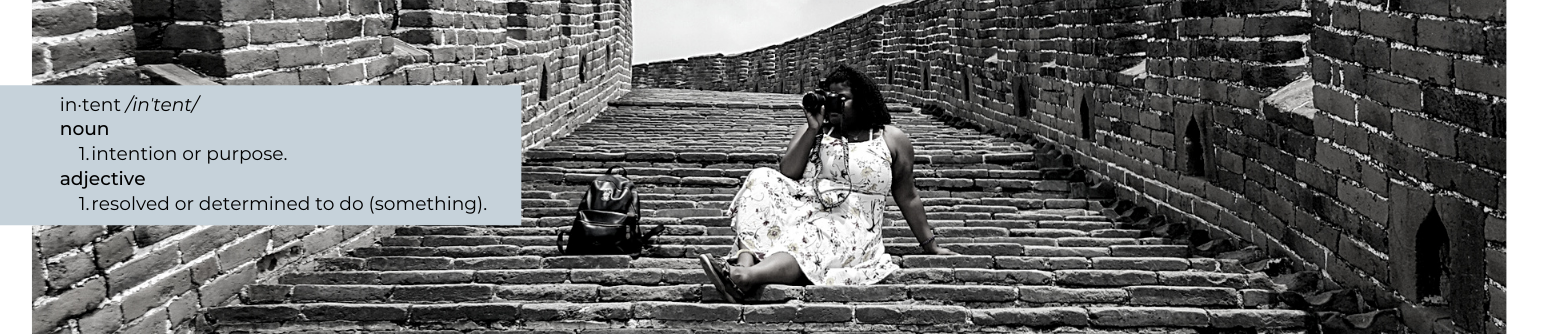 Angelique Michelle sitting on the steps of The Great Wall of China.